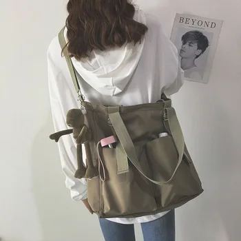 Новая женская сумка через плечо, Корейская версия, однотонная студенческая женская сумка через плечо, Дизайнерская сумка для ноутбука большой емкости.